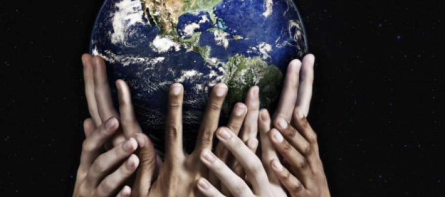 Hands holding a globe of the world